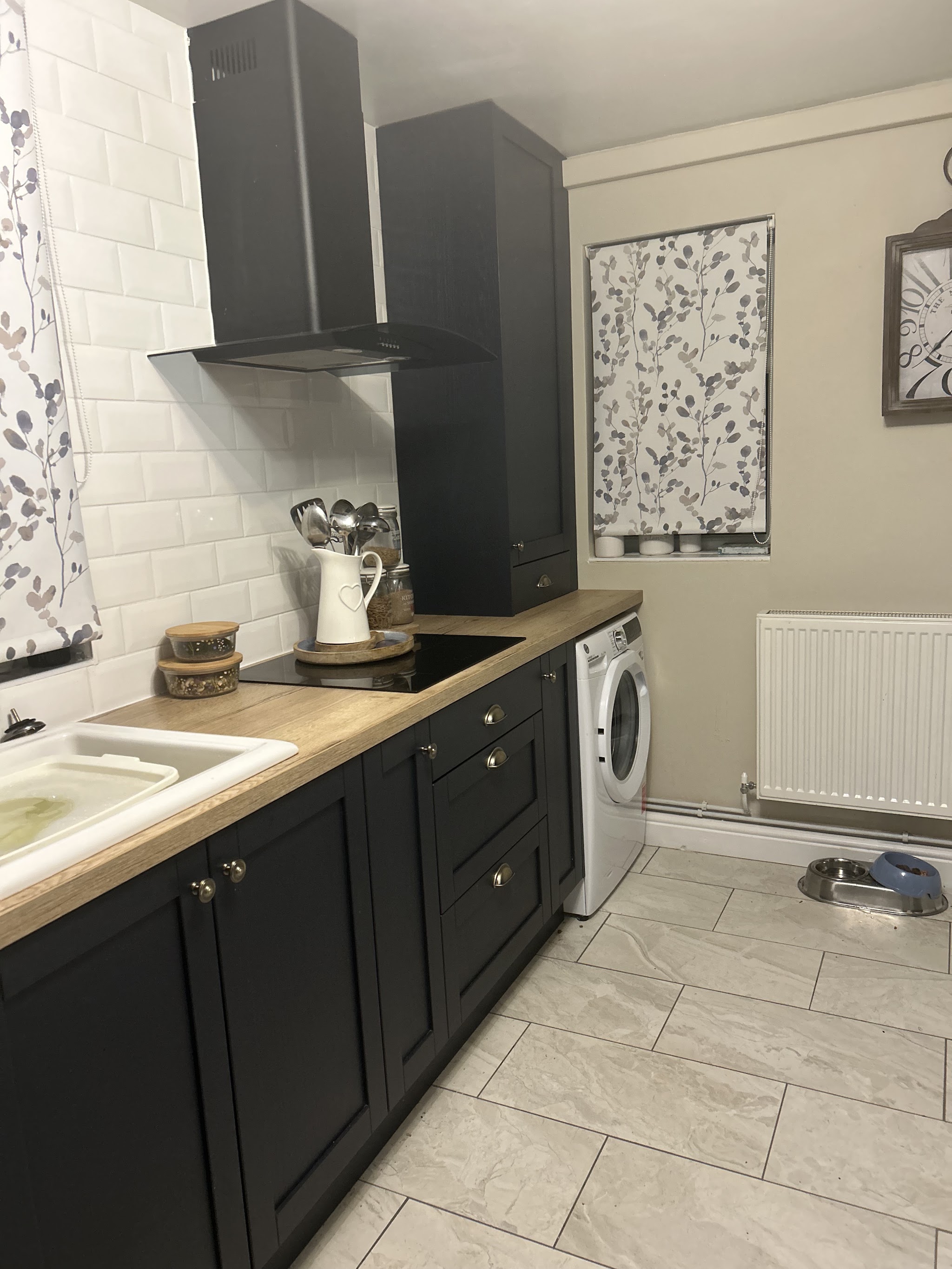 Charcoal shaker style kitchen with oak effect worktop and white metro tiles